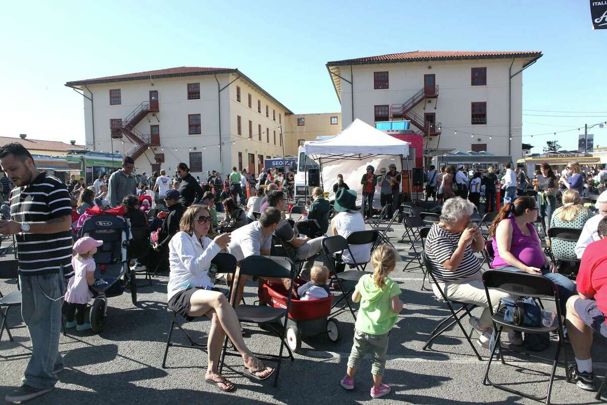 Visitors at Off the Grid at Fort Mason in San Francisco in 2012. The popular food truck event is reopening April 1.