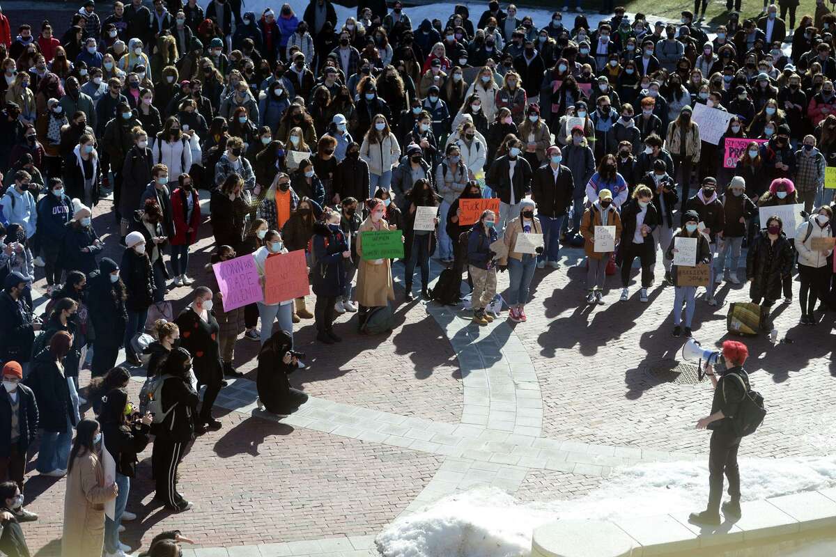 Hundreds of students turned out for a protest on the University of Connecticut campus, in Storrs, Conn. Feb. 9, 2022. The students gathered to express their frustrations with the university’s handling of sexual assault cases.