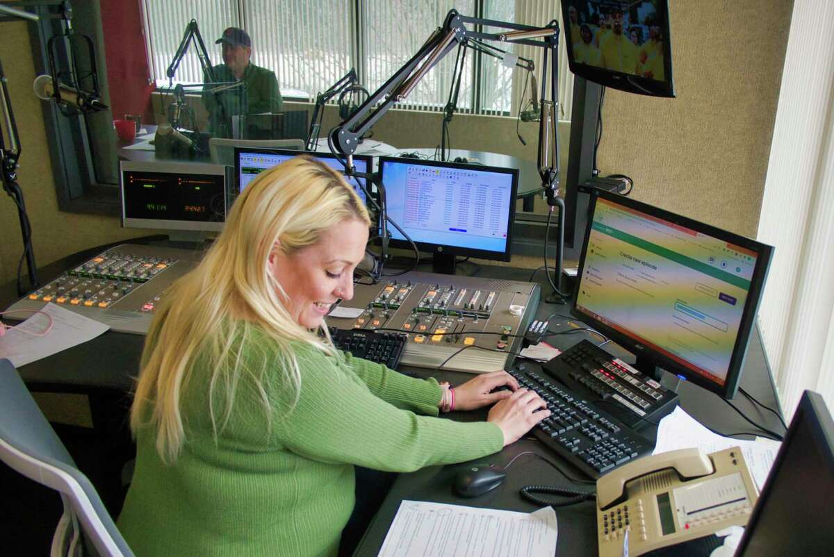 Rachel Davis, WGY morning show producer, works in the control room on Tuesday, Feb. 8, 2022, in Latham, N.Y.