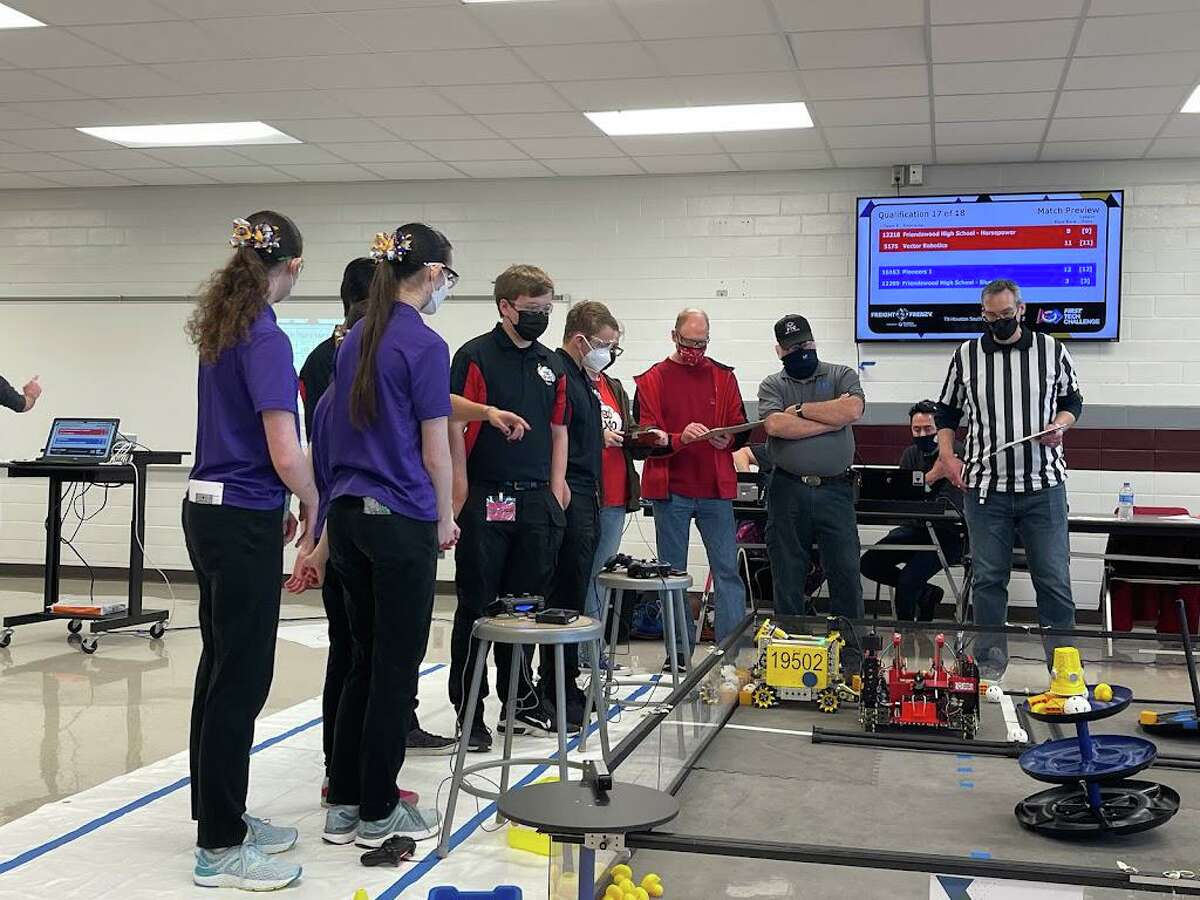 Members of ThunderBolts in Disguise, a robotics team of homeschool students from the League City, Friendswood, Pearland and the Pasadena area, compete during a FIRST Tech Challenge.