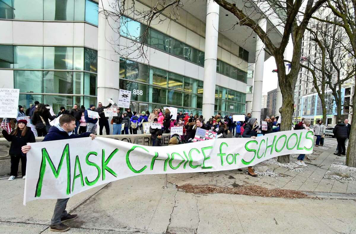 More than 100 anti-mask protesters gather in front of the Government Center in Stamford on Tuesday. The protesters urged the Stamford School District to allow parents to decide whether or not their children wear masks in school.