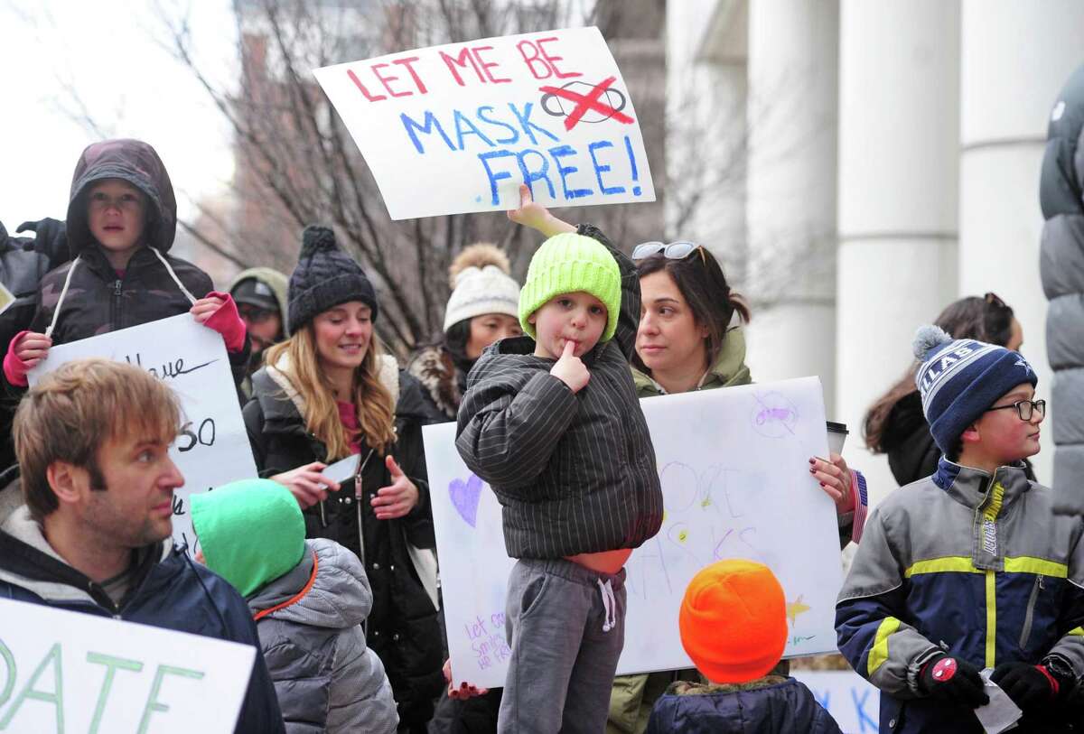 Over 100 anti-mask protesters gather in front of the Government Center in Stamford, Conn., on Tuesday February 28, 2022. The protesters are urging the Stamford School District to allow parents to decide whether or not their chilldren wear masks in school.
