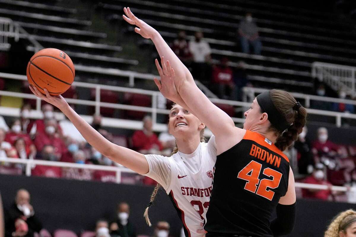 Stanford forward Cameron Brink (22) drives to the basket against Oregon State forward Kennedy Brown (42) during the first half of an NCAA college basketball game in Stanford, Calif., Wednesday, Feb. 9, 2022. (AP Photo/Tony Avelar)