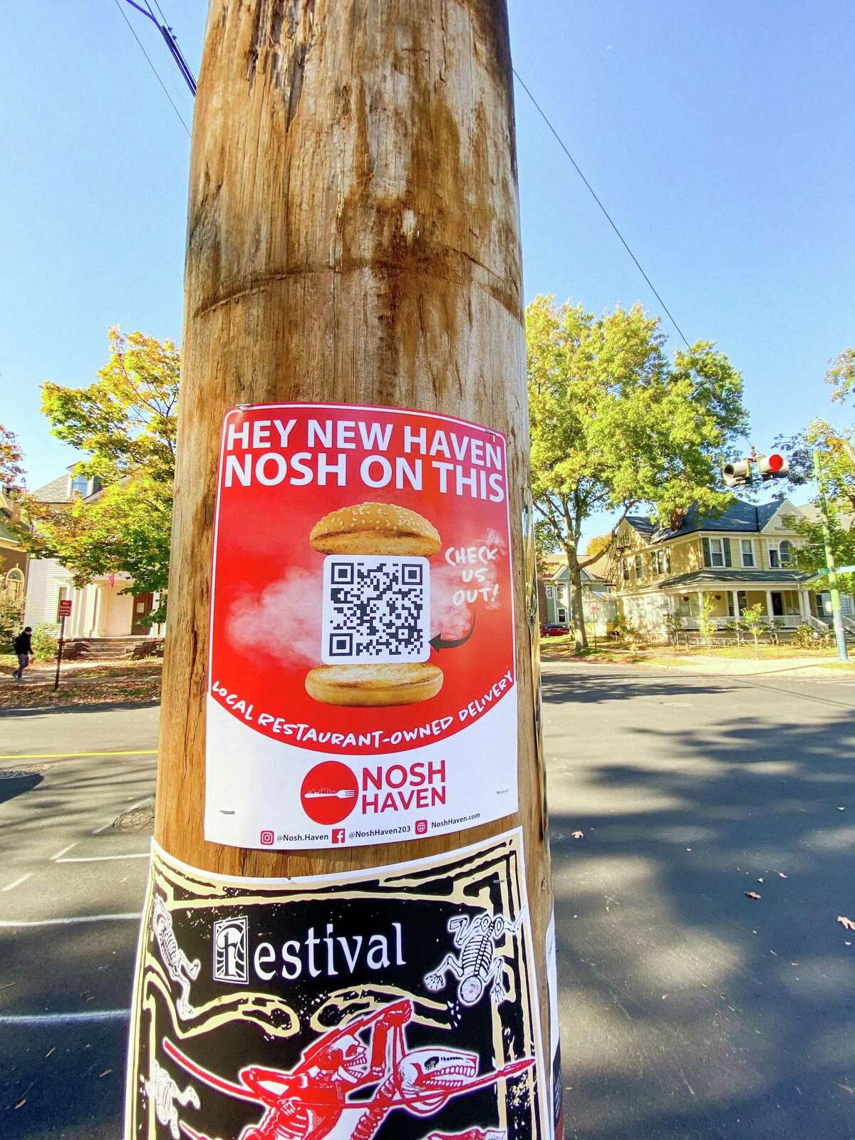 A Nosh Haven post on a utility pole on the corner of Orange and Canner streets in New Haven’s East Rock section.