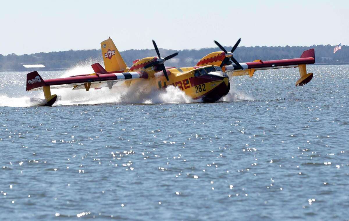 Bridger Aerospace demonstrated their new fully amphibious aircraft used for aerial firefighting, swooping into Lake Conroe to pick up water and then dropping it.