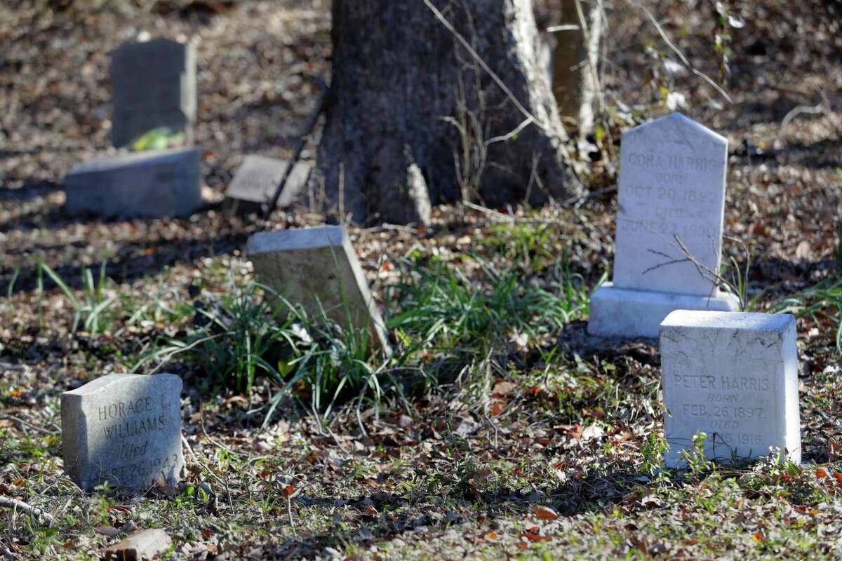 Some of the weed and leaf covered graves in the northeast section of the historically black Olivewood cemetery Saturday, Feb. 5, 2022 in Houston, TX. Some five volunteers spent the morning weed whacking, raking leaves and doing general clean up across the cemetery.