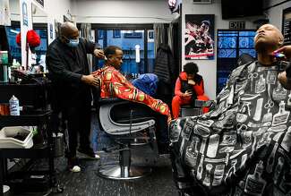 It's not just a haircut. Why barbershops are a haven for Black men