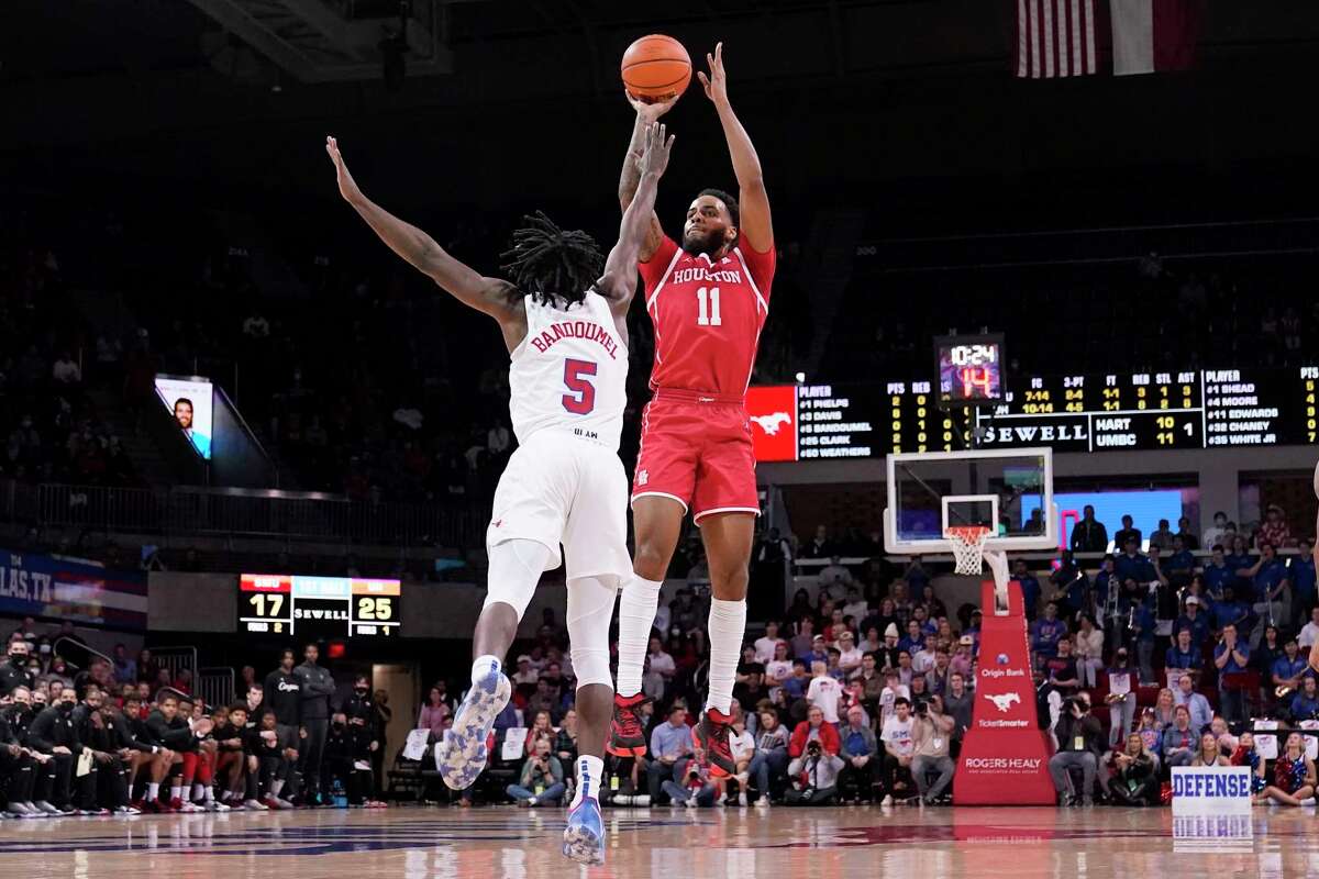 SMU guard Emmanuel Bandoumel defends a shot by UH guard Kyler Edwards in the first half Wednesday in Dallas. Edwards had 17 points but missed a key free throw in the final seconds after getting fouled by Bandoumel.
