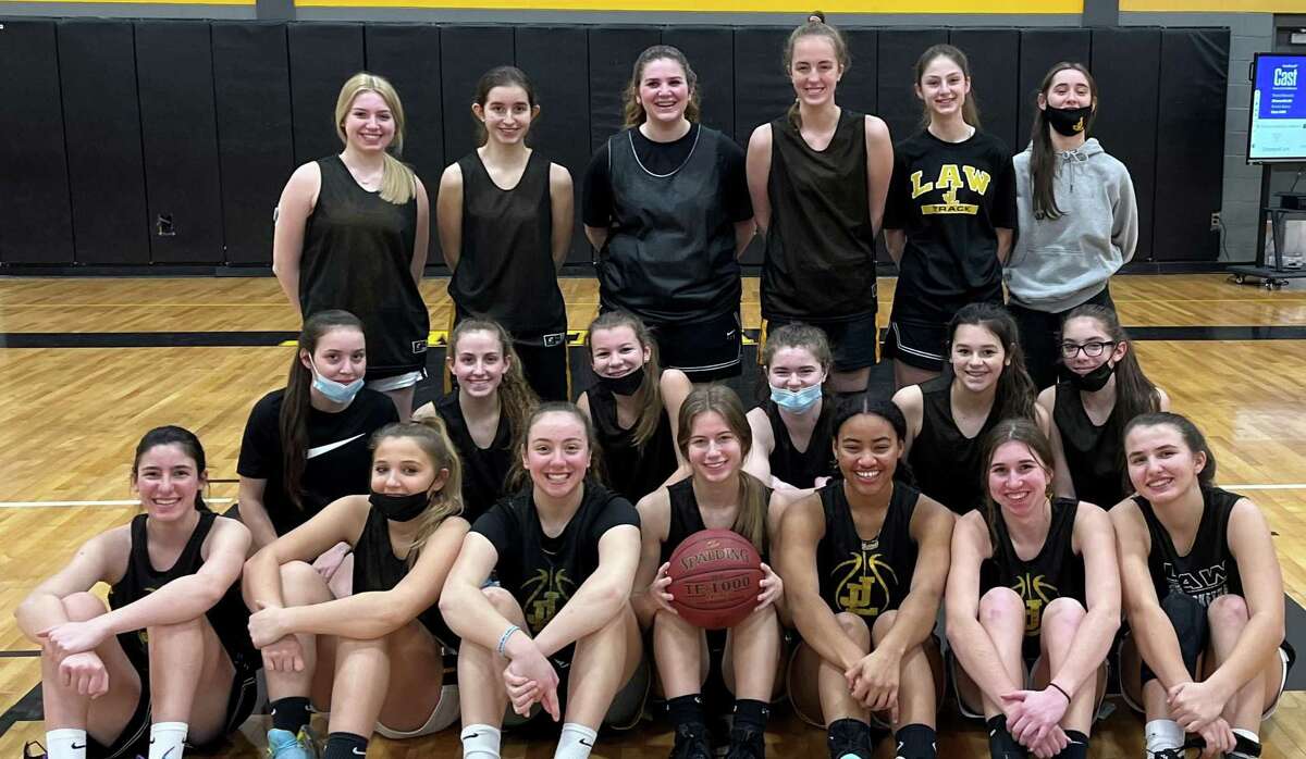 Jonathan Law won the SCC Quinnipiac Division for its first girls basketball title. Team members (front row) are Sabrina Lawless, Talia Salanto, Shelby Green, Paige Jolley, Mariyah Reid, Jenna Wasserman and Nicolina Salanto; (second row) Chloe Piccirillo, Macie Rascoll, Chloe Konareski, Zoe Johnson, Tessa Piselli andTaylor Coretti; (standing) Grace Baird, Emily DeLucia, Lily Baird, Chloe Haasch, Ella Franzman and Sydney Nobles.