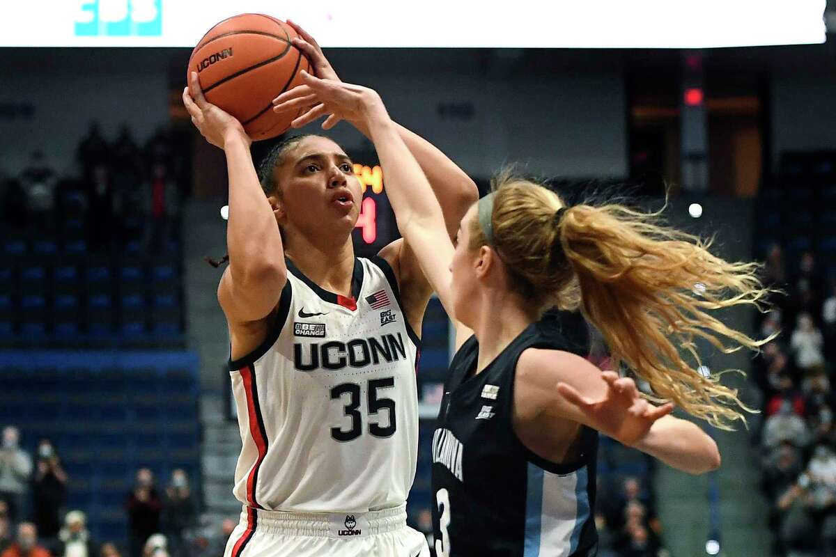 UConn’s Azzi Fudd shoots as Villanova’s Lucy Olsen defends in the first half on Wednesday.