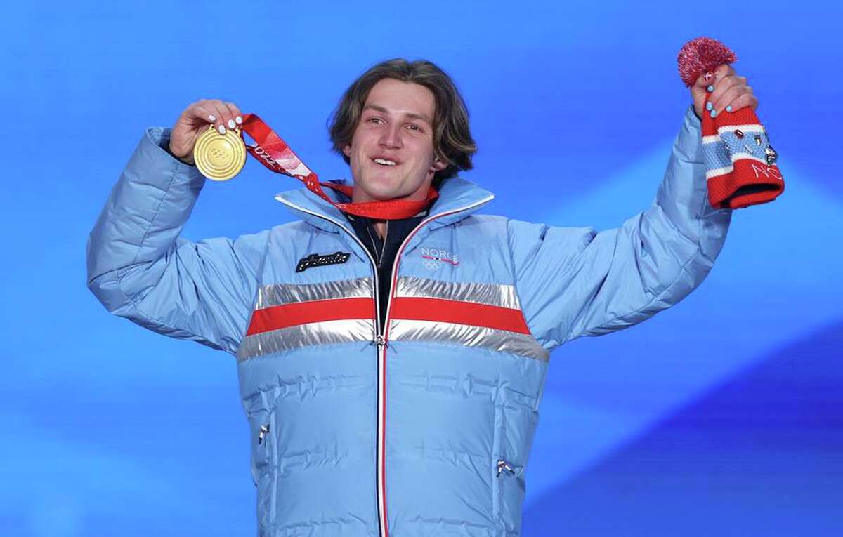 Gold medalist Birk Ruud of Team Norway rejoices after the men's Freeski Big Air medal ceremony at Beijing Medal Plaza.