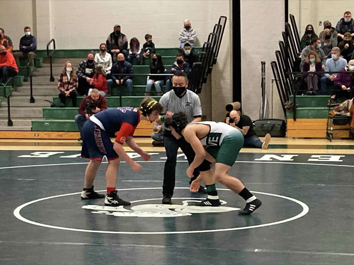 New Milford's Angelo Fernandez (green) and New Fairfield's Anthony McKauge (red) square off.