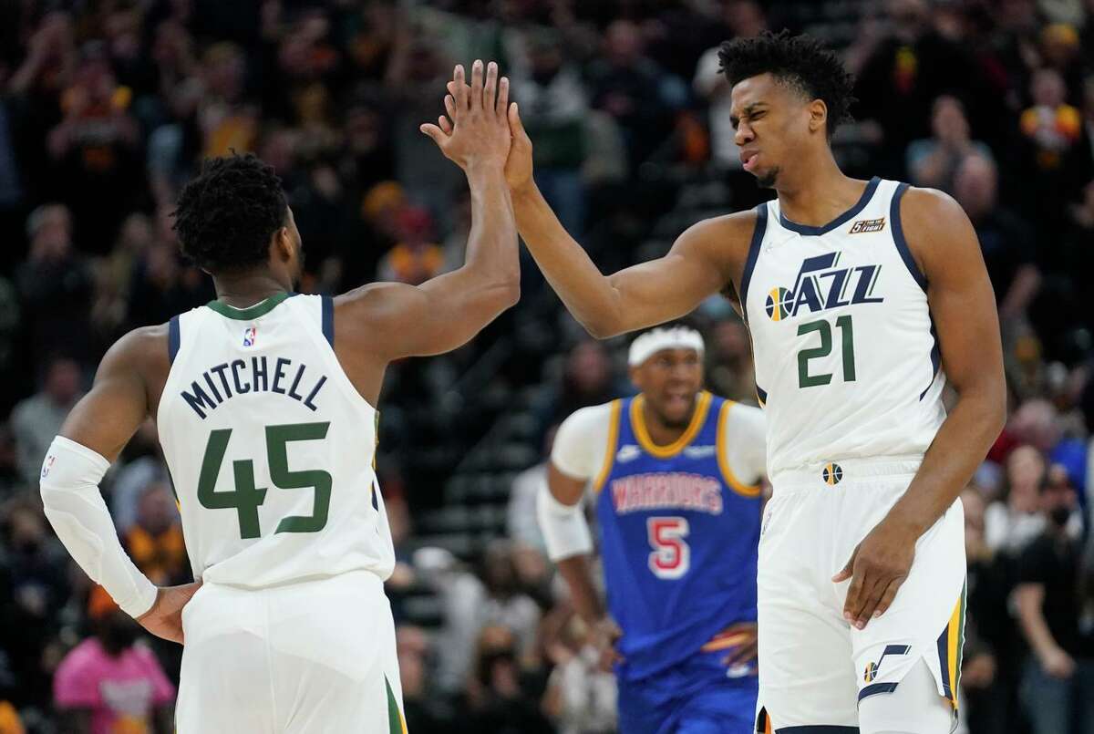Utah’s Donovan Mitchell and Hassan Whiteside enjoy their easy victory over the Warriors on Wednesday night in Salt Lake City.