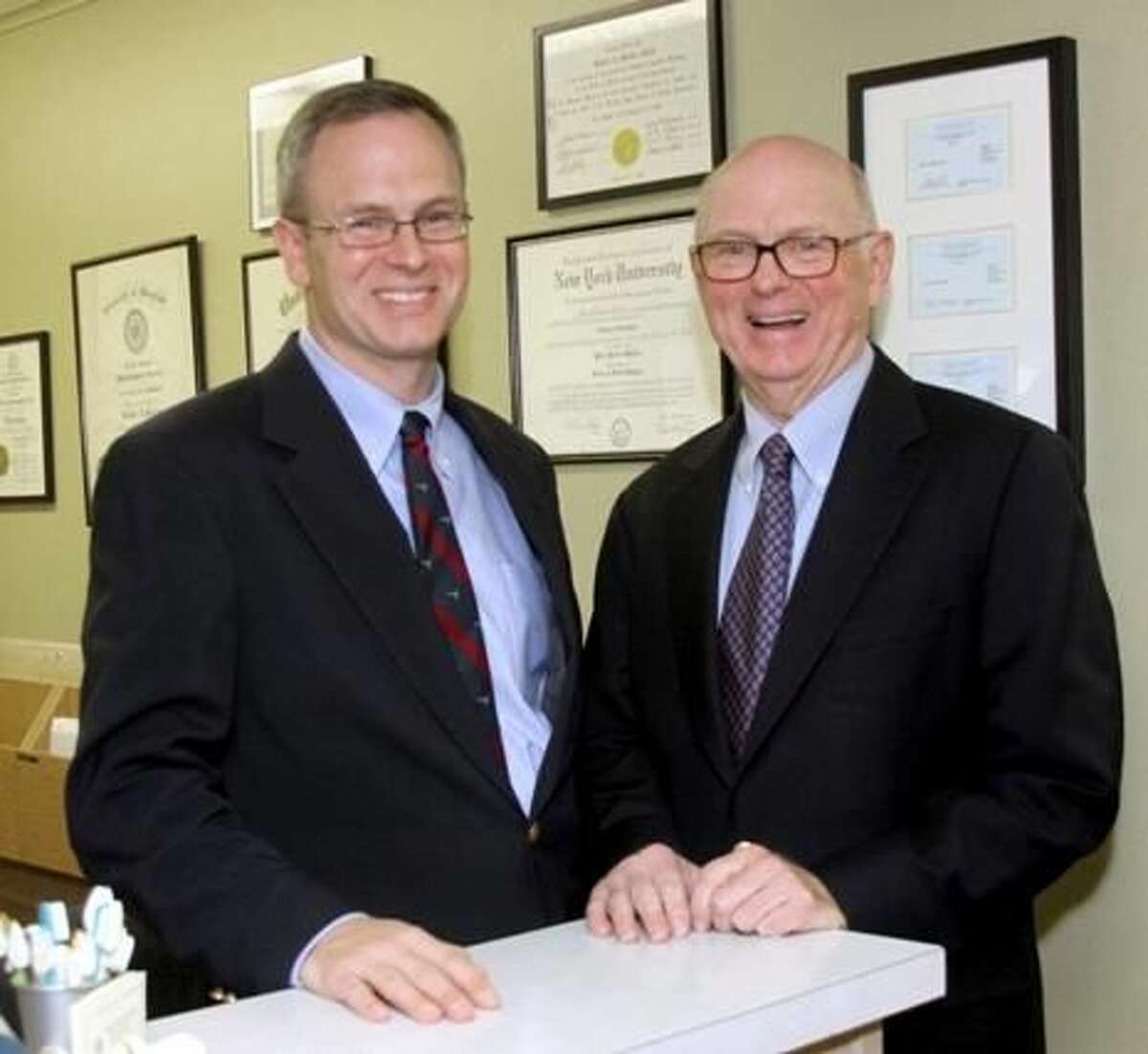 Left, Dr. John Mullen, an orthopedic surgeon, and his father, Dr. Robert Mullen, a dentist in New Milford. Photo by Walter Kidd.