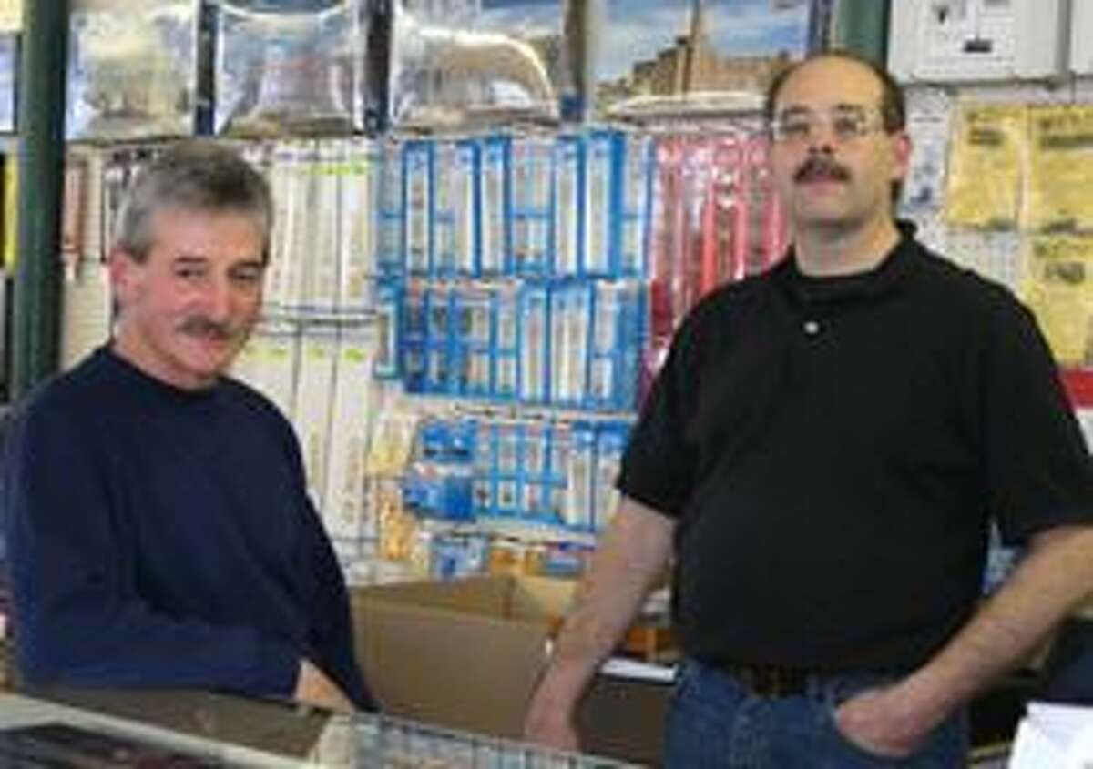 Roger Moreau, left, and Tim Sweeney at Railroad Model and Hobby Supply in Winsted. Photo by Kathryn Boughton.