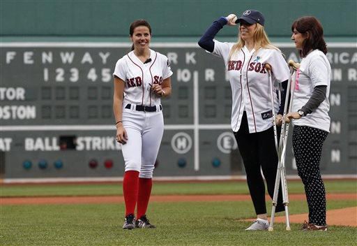 Marathon victim throws first pitch as Boston slowly heals