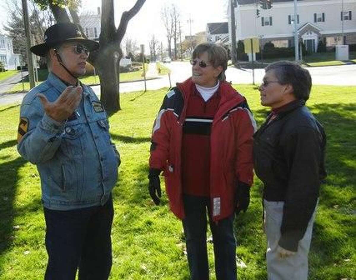 From left, Vietnam veteran Tony Pisano, Marie Crawford and Judge Martin Landgrebe, all of New Milford. Photo by Alice Tessier.