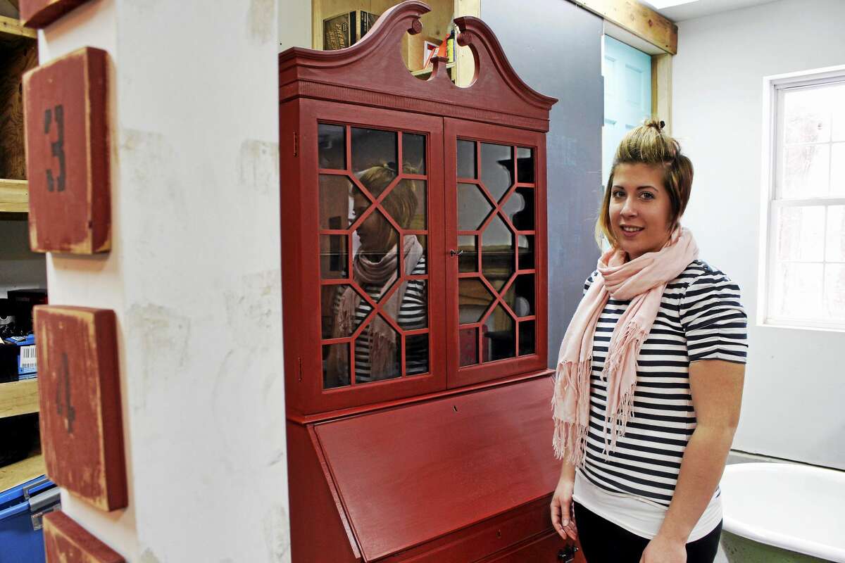 Nicole Goncalves stands in front of a secretaire that she has refurbished. Photos by Shako Liu.
