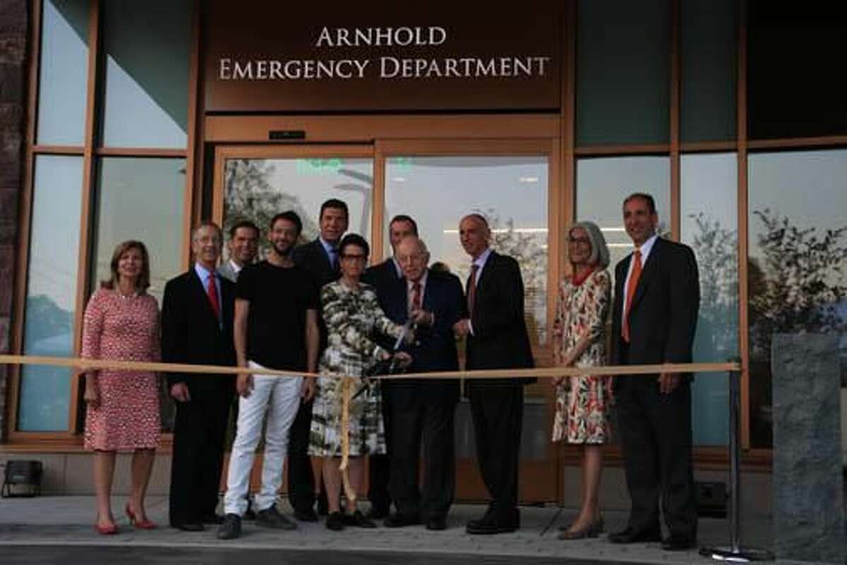 Photo by John Fitts New Milford Hospital officials and members of the Arnhold family cut the ribbon on the new Arnhold Emergency Department.