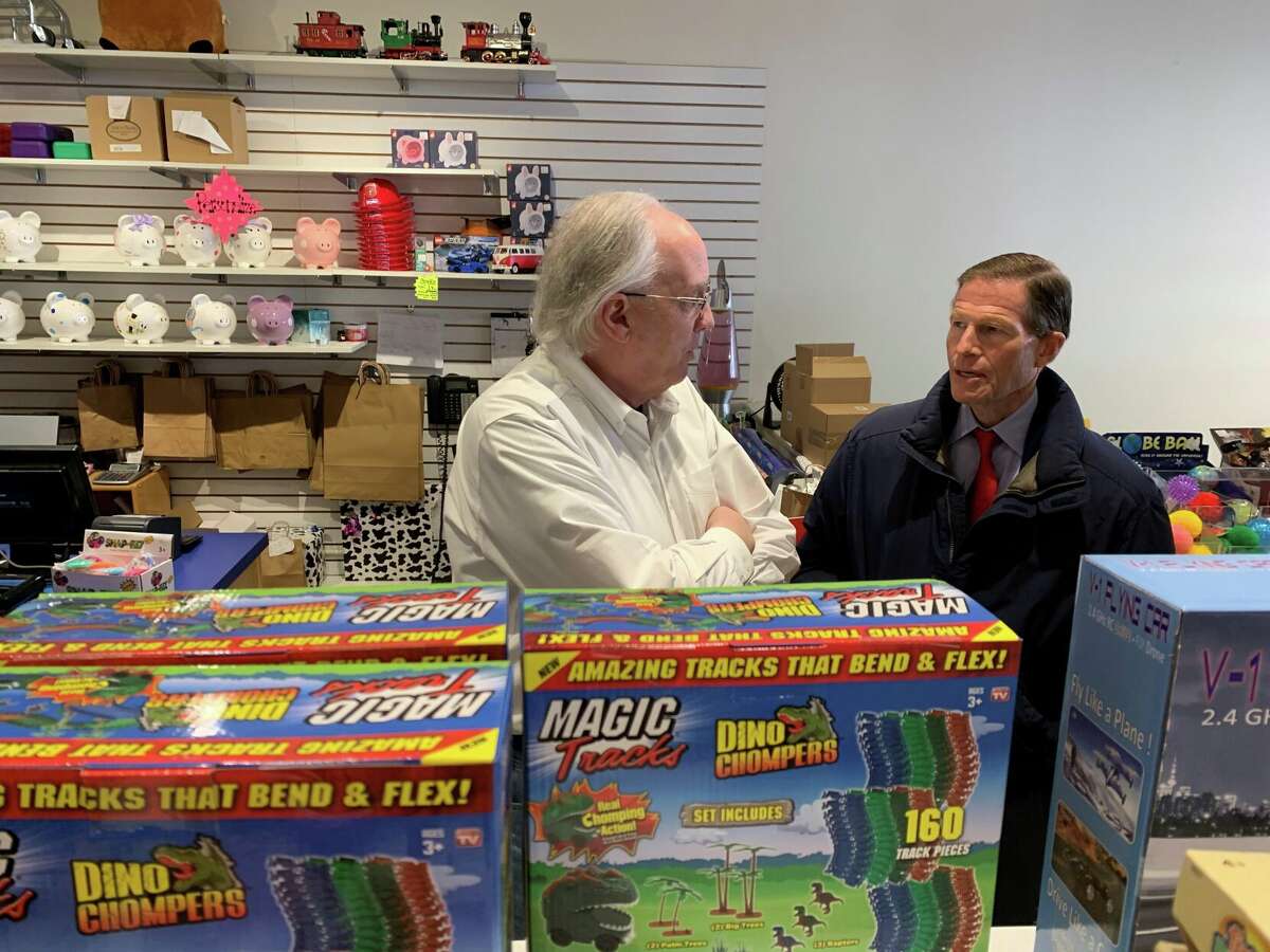 Toy Chest manager Ed Dunn speaks with U.S. Sen. Richard Blumenthal about how business has been going lately.