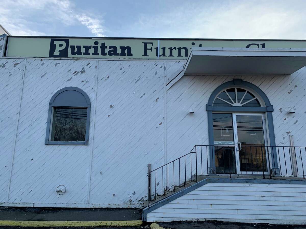 Developers are planning to turn the former site of Puritan Furniture into a 131 unit mixed-income, mixed-used transit-oriented development. The town received nearly $1 million from the state to help clean up the site.