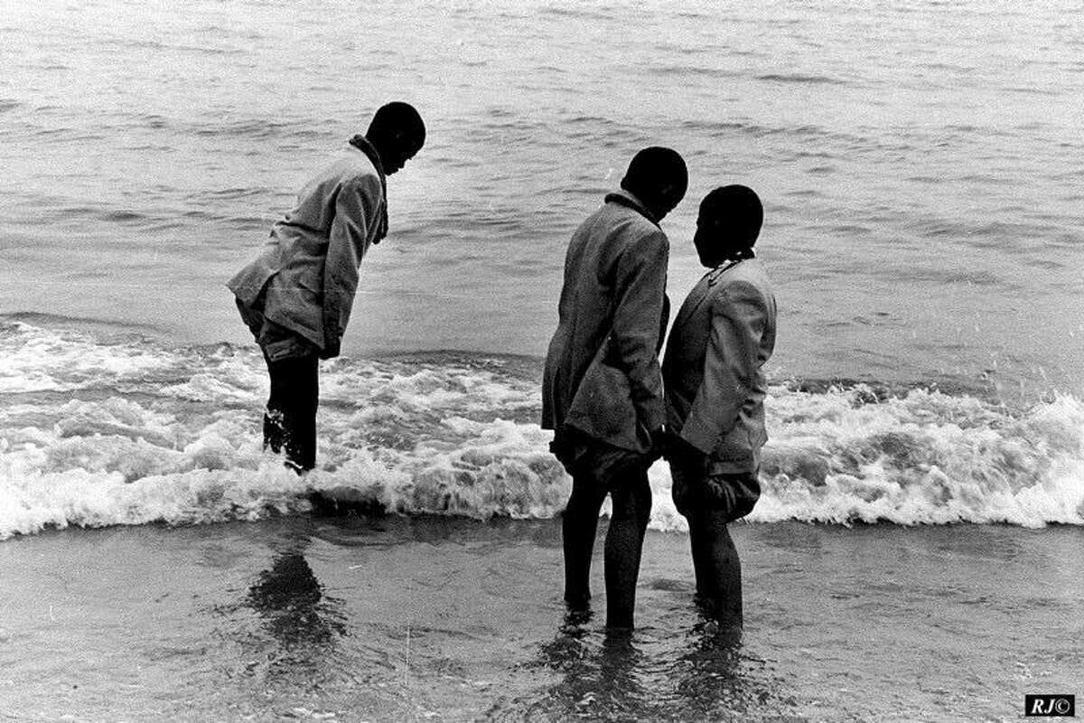 Contributed photo “Three Youths Wading” by Raymond Jacobs.