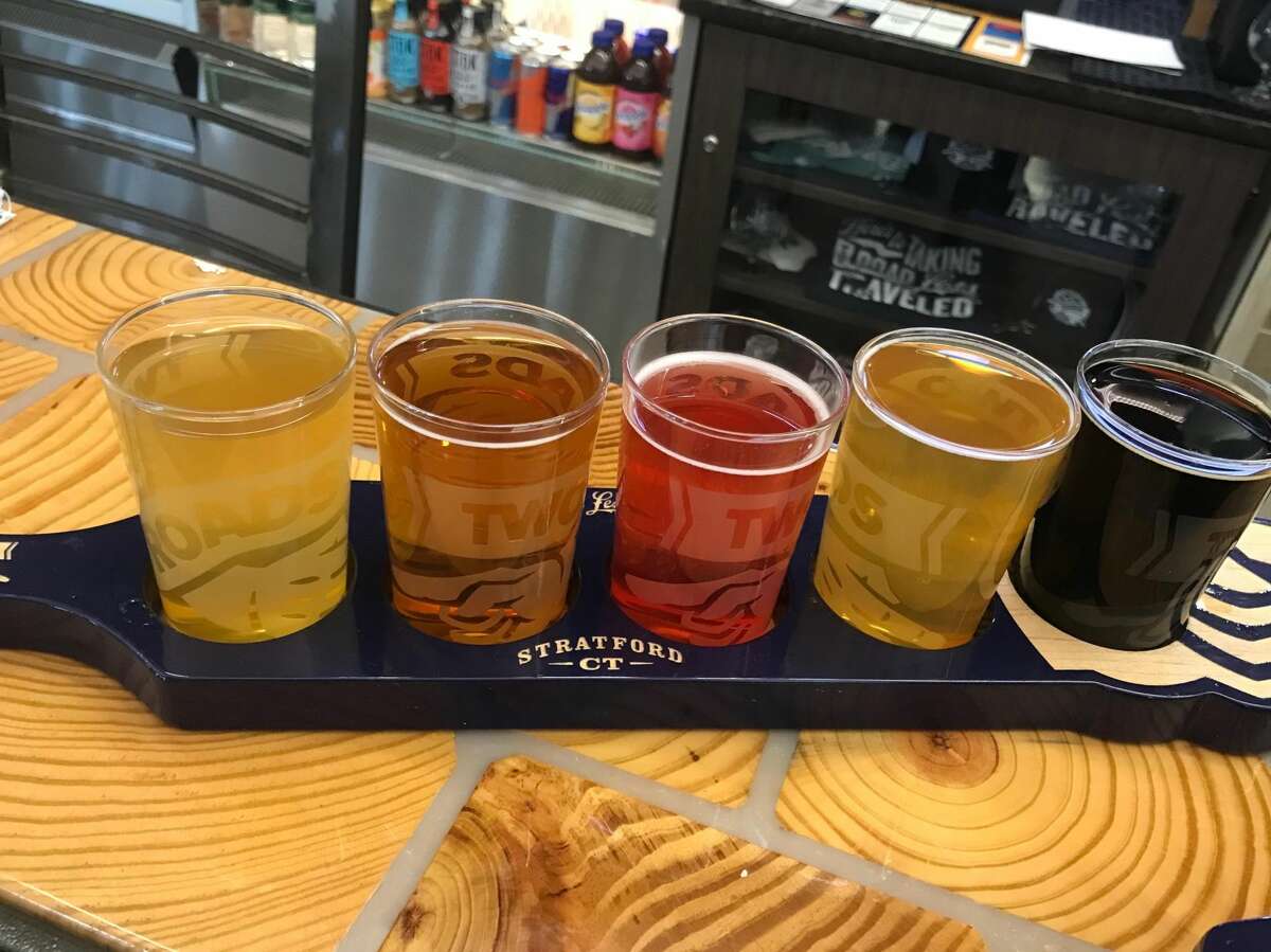 A flight of beers from Two Roads Brewery awaiting patrons of the Stratford-based craft brewer's Bradley International location. Two Roads new location earlier this year as part of an ongoing effort to improve concessions available for travelers.
