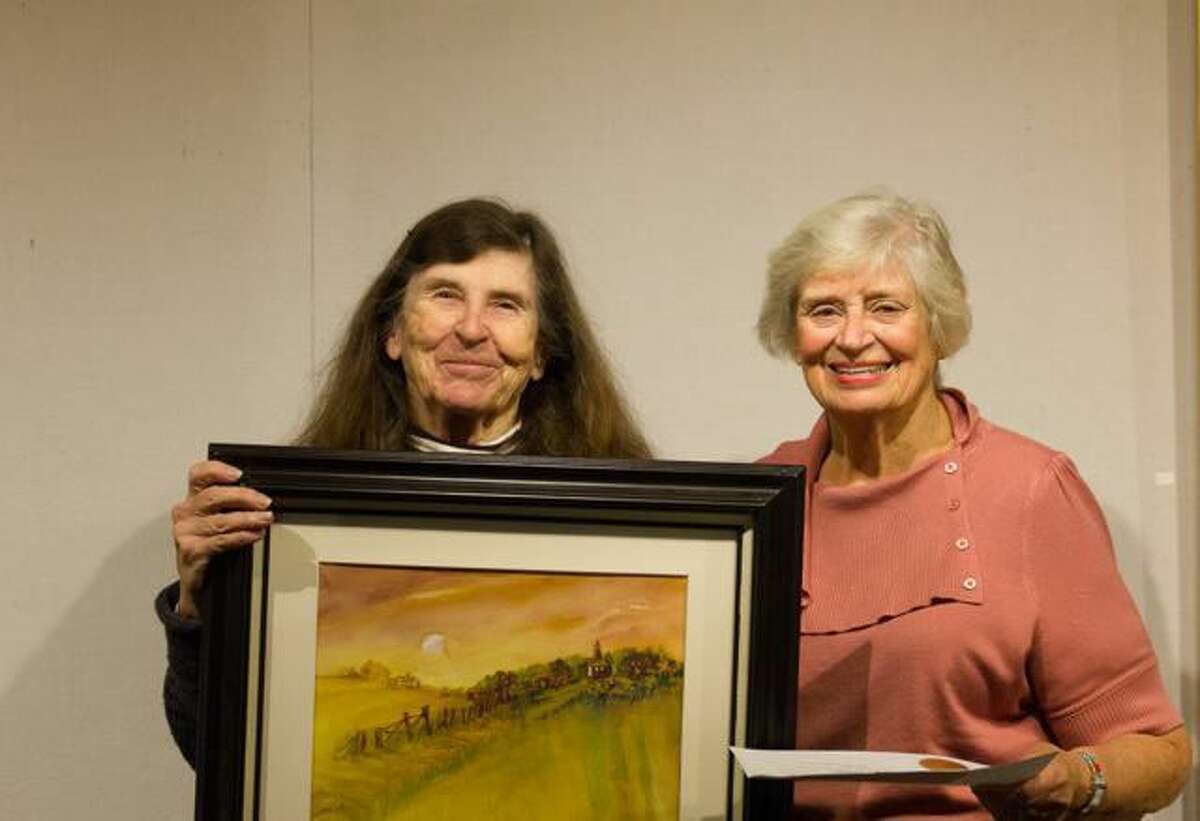 Janet Reasoner of Hyde Park, N.Y. receives an Award of Excellence from KAA President, Connie Horton for her watercolor titled ?“Road at Twilight.?”