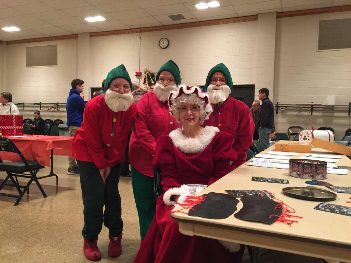 Torrington held its annual Toy Shower, an event that benefits Christmas Village by providing a toy for every child who visits, at the Coe Memorial Park Civic Center. Above, Mrs. Claus and her elves greet their guests.