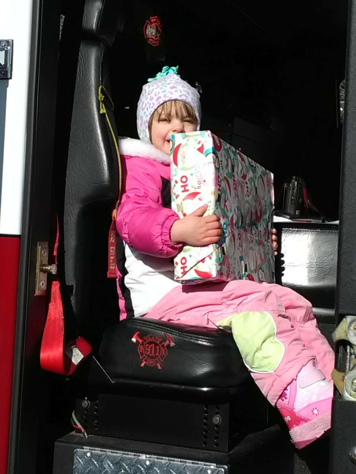 Santa Claus visited families on Eden Lane in New Milford on Sunday, Dec. 10 for Water Witch Hose Company No. 2's annual Santa Express. Each child received a gift from Santa and a chance to sit in the fire truck, including Johnna Morse, 2.