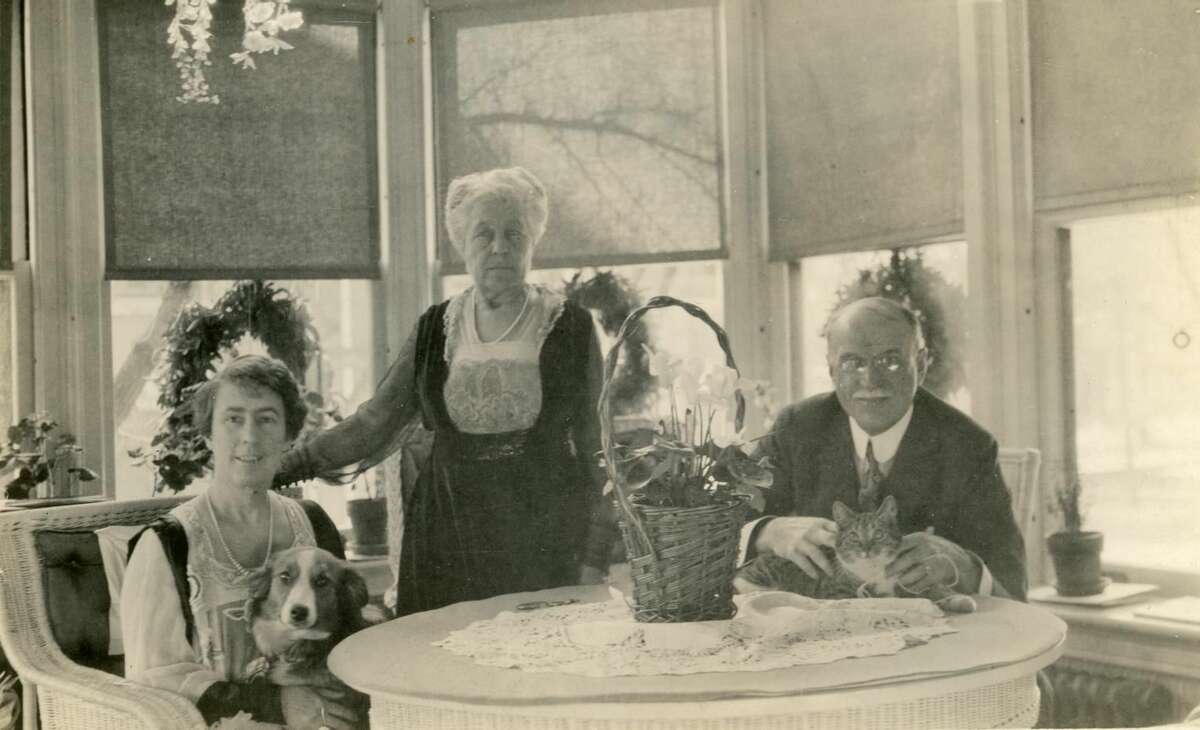 Pets have a long history in the Hotchkiss-Fyler House, now the home of the Torrington Historical Society. From left: Gertrude Fyler Hotchkiss, Mary Fyler, and Edward Hotchkiss, along with their dog and cat, in a photo taken circa 1930.