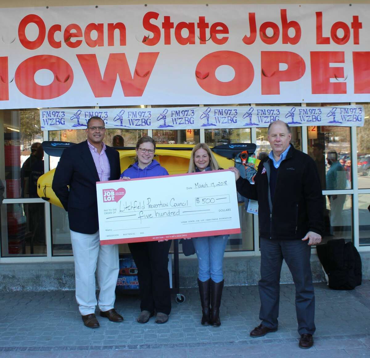 Ocean City Job Lot in Litchfield celebrated its grand opening with a ribbon cutting ceremony and a donation to the Litchfield Prevention Council. From left are James Hines, Ocean State Job Lot Regional Director; Jaime Makuc and Mikki Pettinicchi, Litchfield Prevention Council; and David Sarlitto, Executive Director, Ocean State Job Lot.　