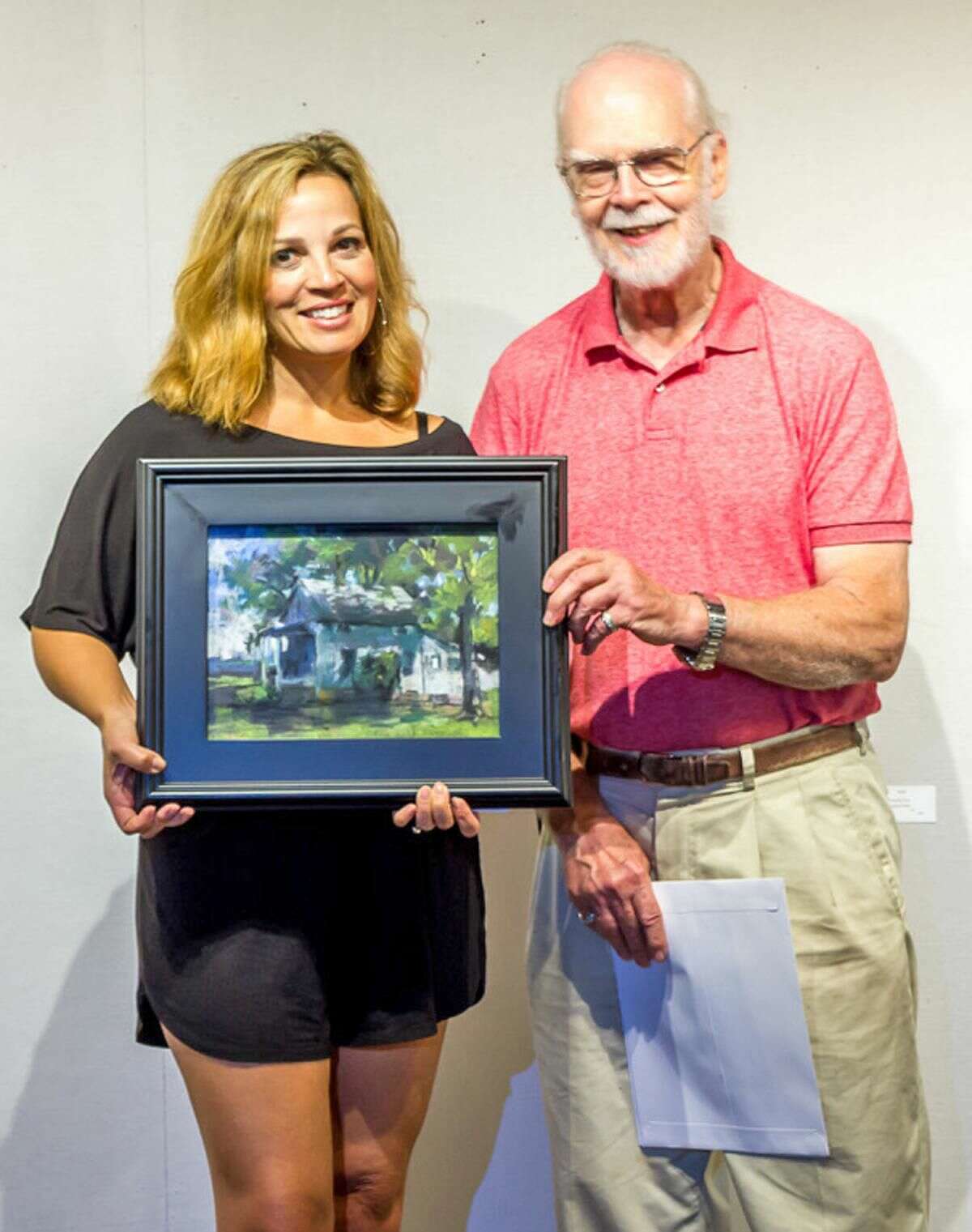 Show Chairman Clayton Buchanon Christine Vitarello receives the Frank Federico Award of Excellence in Pastel for her Pastel titled ?“Nutmeg House.?” The award is being presented by Show Chair Clayton Buchanan.