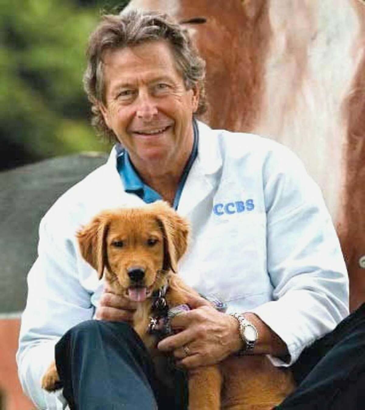 Dr. Nicholas Dodman, of the Center for Canine Research Studies, with a small friend. Dodman and his associates hope to provide a better understanding of dog behavior so that there are less surrenders to animal shelters, and happier canines and owners.