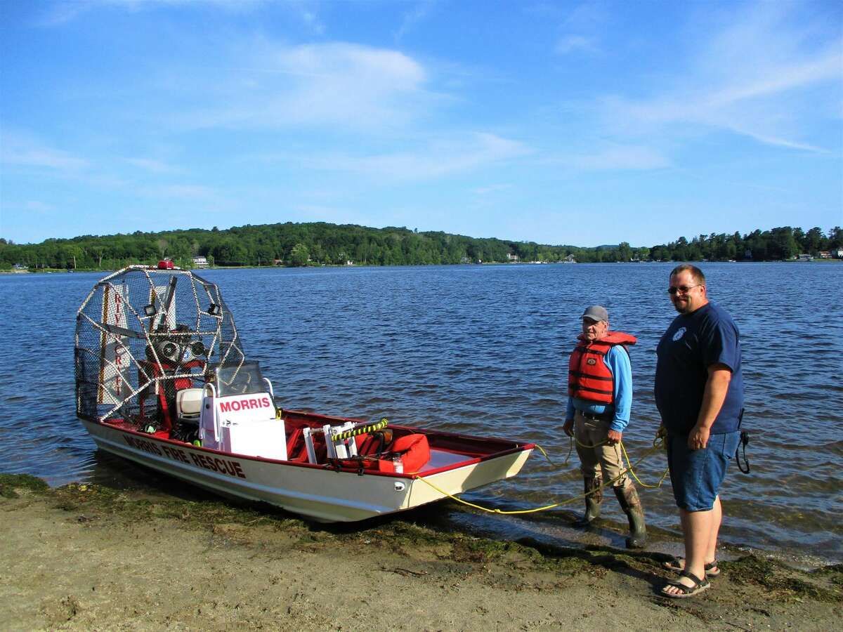 Steve Maughmer and George Humphrey III stand ready with the Morris Fire Company rescue airboat.