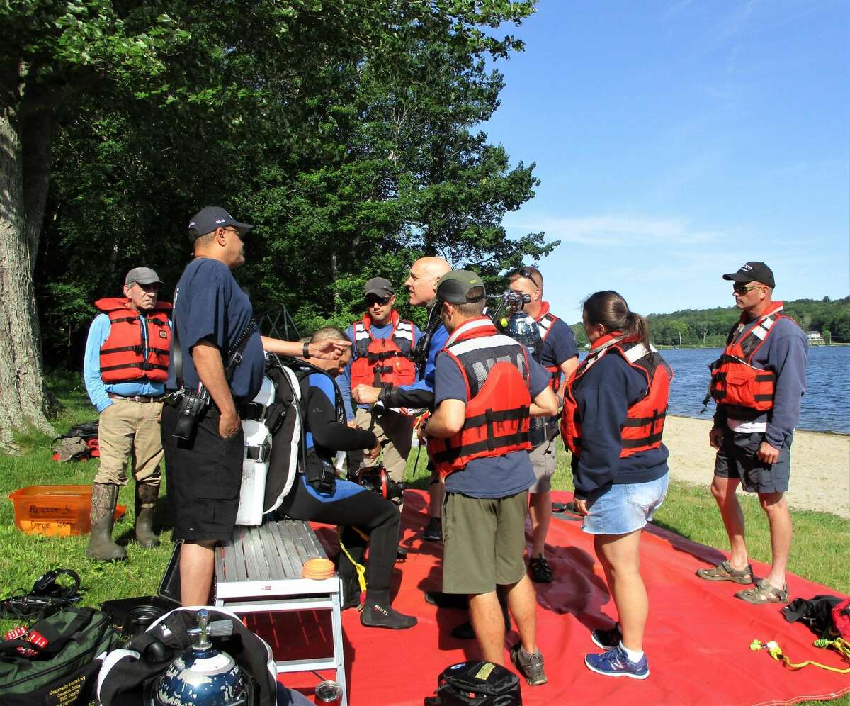 Kevin Robinson, second on the left, Litchfield County Coordinator, shared his rescue diving experiences with Morris Fire Company members.