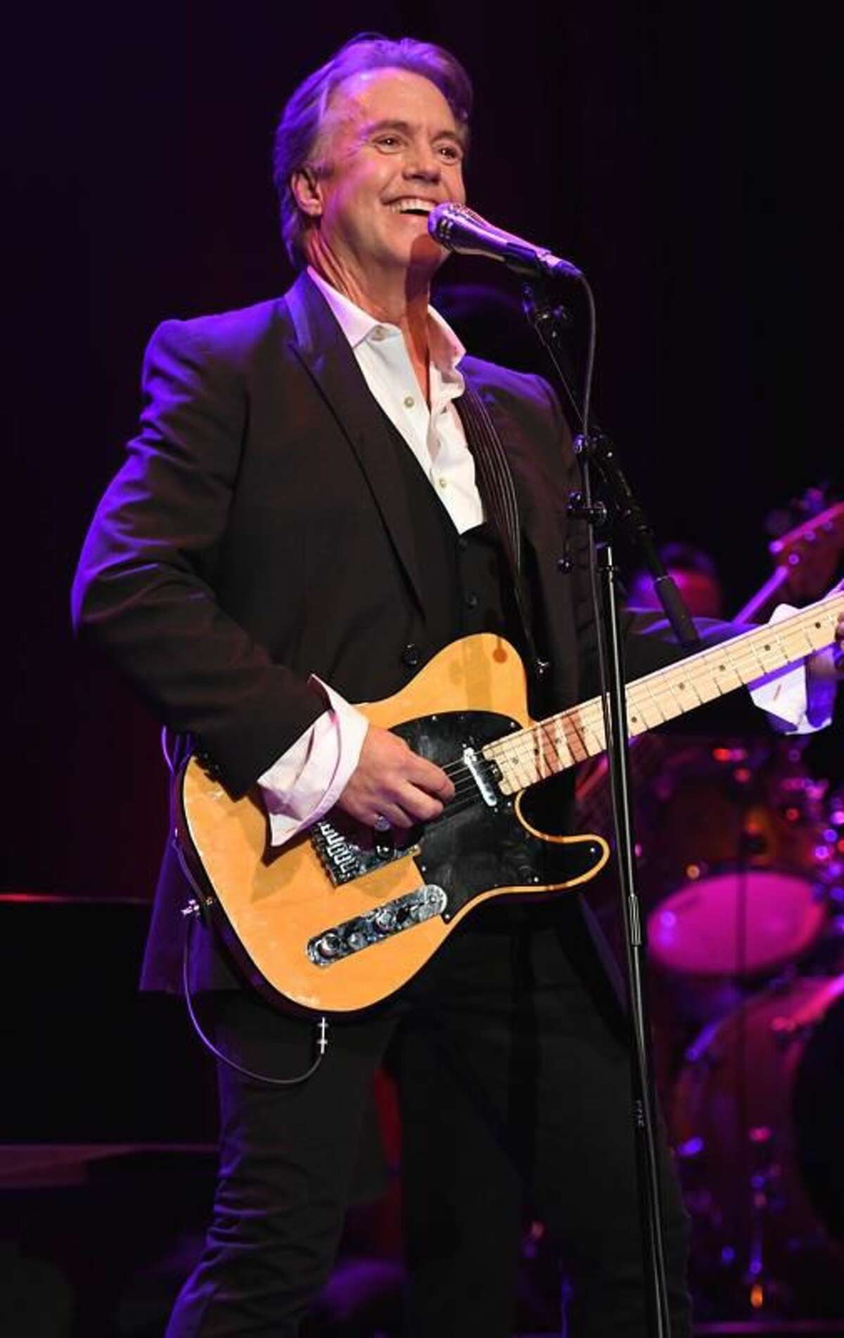 Singer, writer, actor and producer Shaun Cassidy is shown performing on stage during his “live” concert appearance at the Ridgefield Playhouse Aug. 5, 2019. The special show kicked off his first concert tour in nearly 40 years and attracted a sold out crowd of enthusiastic fans that enjoyed every minute of his performance. Cassidy starred in the television series “The Hardy Boys Mysteries” and “Breaking Away.” In the 1980s and ’90s, Cassidy worked almost exclusively as an actor in the theater, performing on Broadway. Since the mid-1990s, Cassidy has been a writer and producer in television, creating and producing a number of television series, including “American Gothic,” “Roar” and “Invasion.” He is currently the consulting producer on NBC’s medical drama “New Amsterdam” and “Blue Bloods.” Cassidy is the eldest son of Academy Award winning actress Shirley Jones and Tony Award winning actor Jack Cassidy. His older half-brother was David Cassidy of Partridge Family fame.