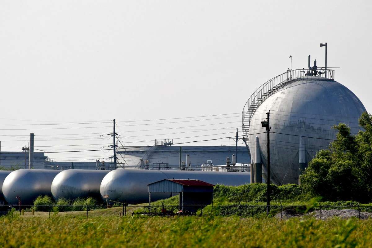 Natural gas sits in storage tanks