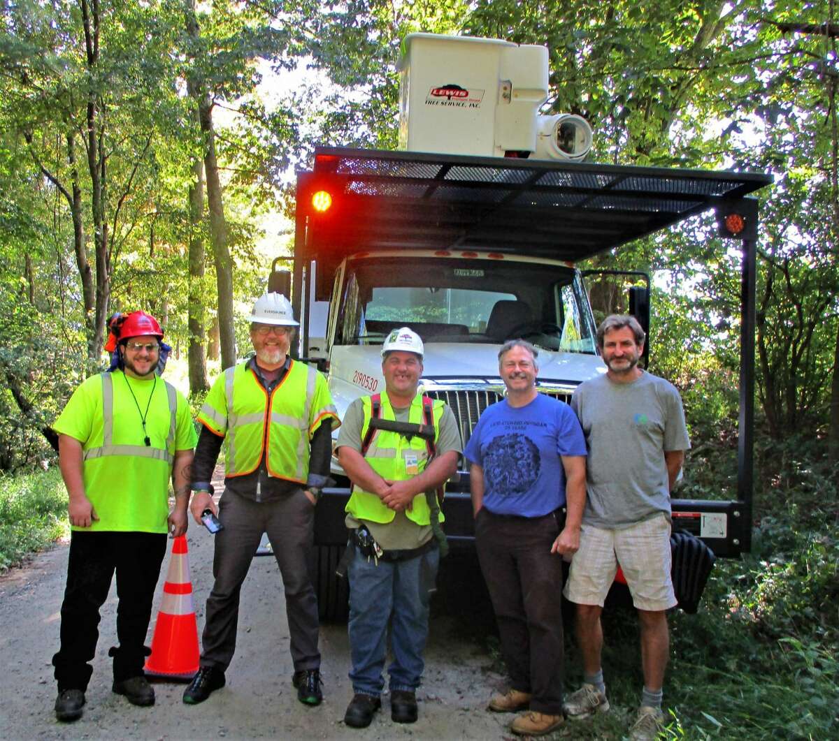 From left, Rob Molito, Eversource groundsman, David Doyle, arborist, Scott Hall, I.S.A. certified arborist, Jack Swatt, president of CT Chapter of the American Chestnut Foundation, and Richard Wilhem, Roxbury resident who discovered the rare chestnut tree.