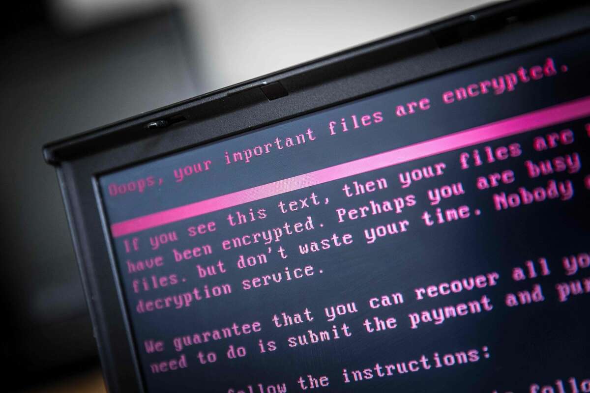 In this file photo taken on June 27, 2017, a laptop displays a message after being infected by a ransomware as part of a worldwide cyberattack in Geldrop.