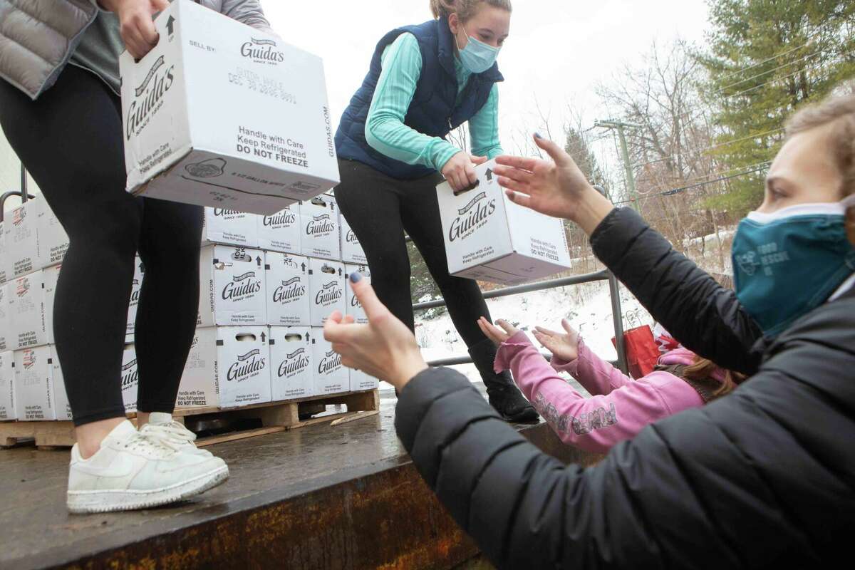 Litchfield County 4-H members deliver milk to local food pantries.
