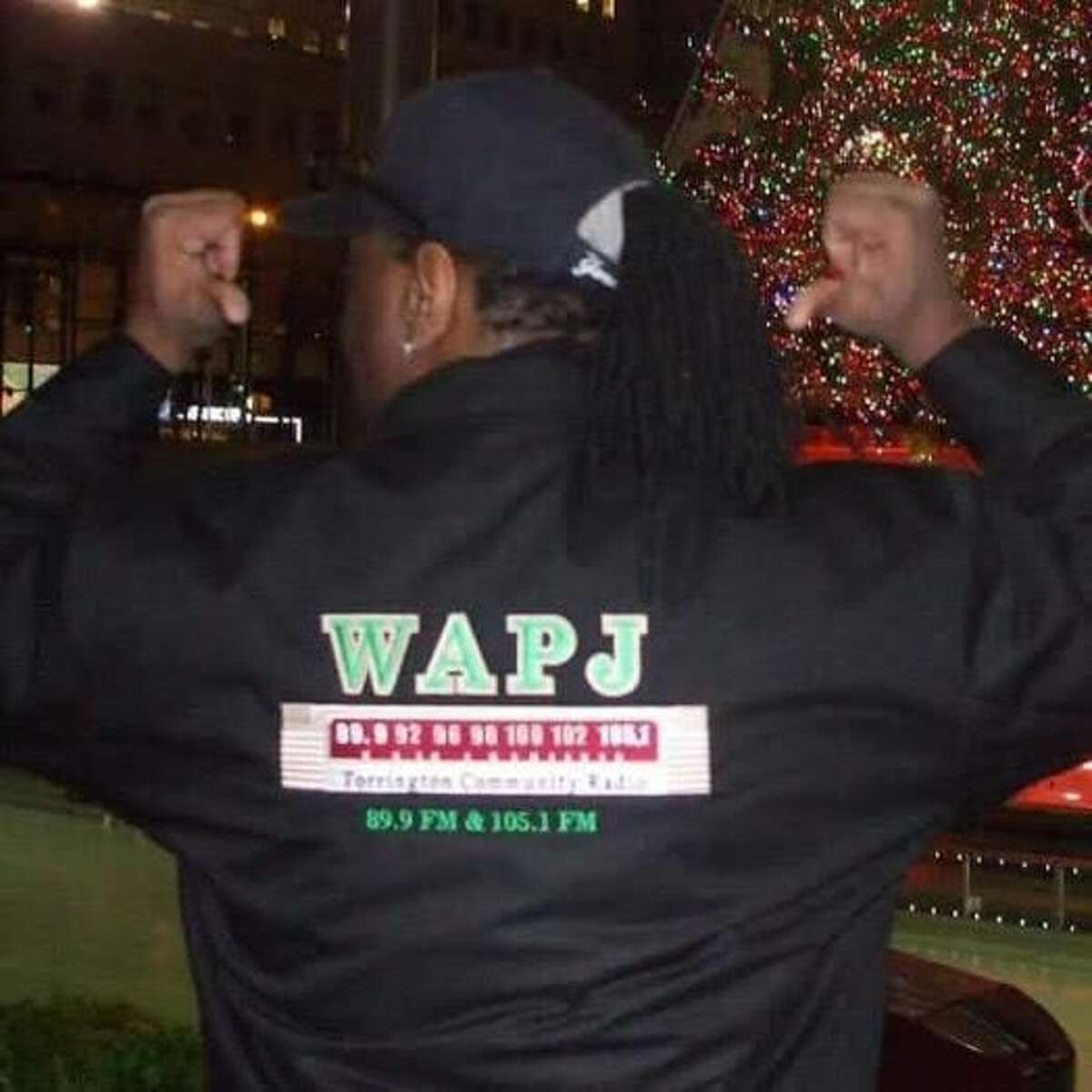 Torrington resident Jacque Williams, a singer-songwriter, is releasing “This Guy”,March 1. Half the proceeds will go to local nonprofit organizations including food banks and a local homeless shelter. Here, Williams, also a DJ with WAPJ, shows off his WAPJ jacket.