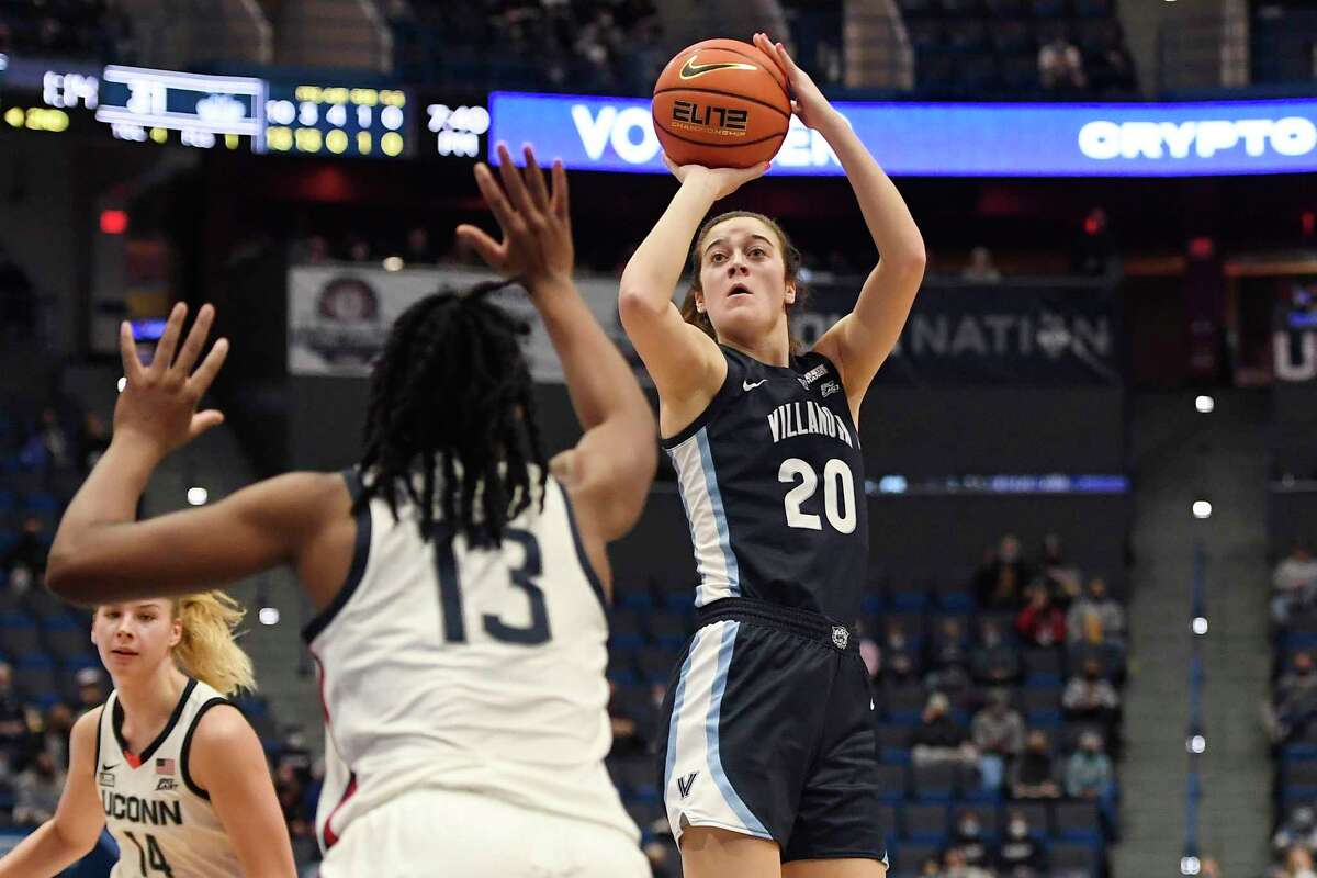 Villanova’s Maddy Siegrist (20) shoots over UConn’s Christyn Williams (13) in the first half of an NCAA college basketball game on Wednesday in Hartford.