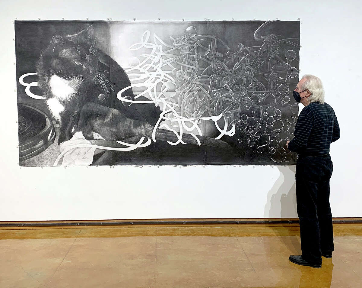 Director Dennis Kiel looks at "Bubbles" by Mayuko Ono Gray which is on display at the Dishman Art Museum, Jan. 22-March 5. Photo by Andy Coughlan