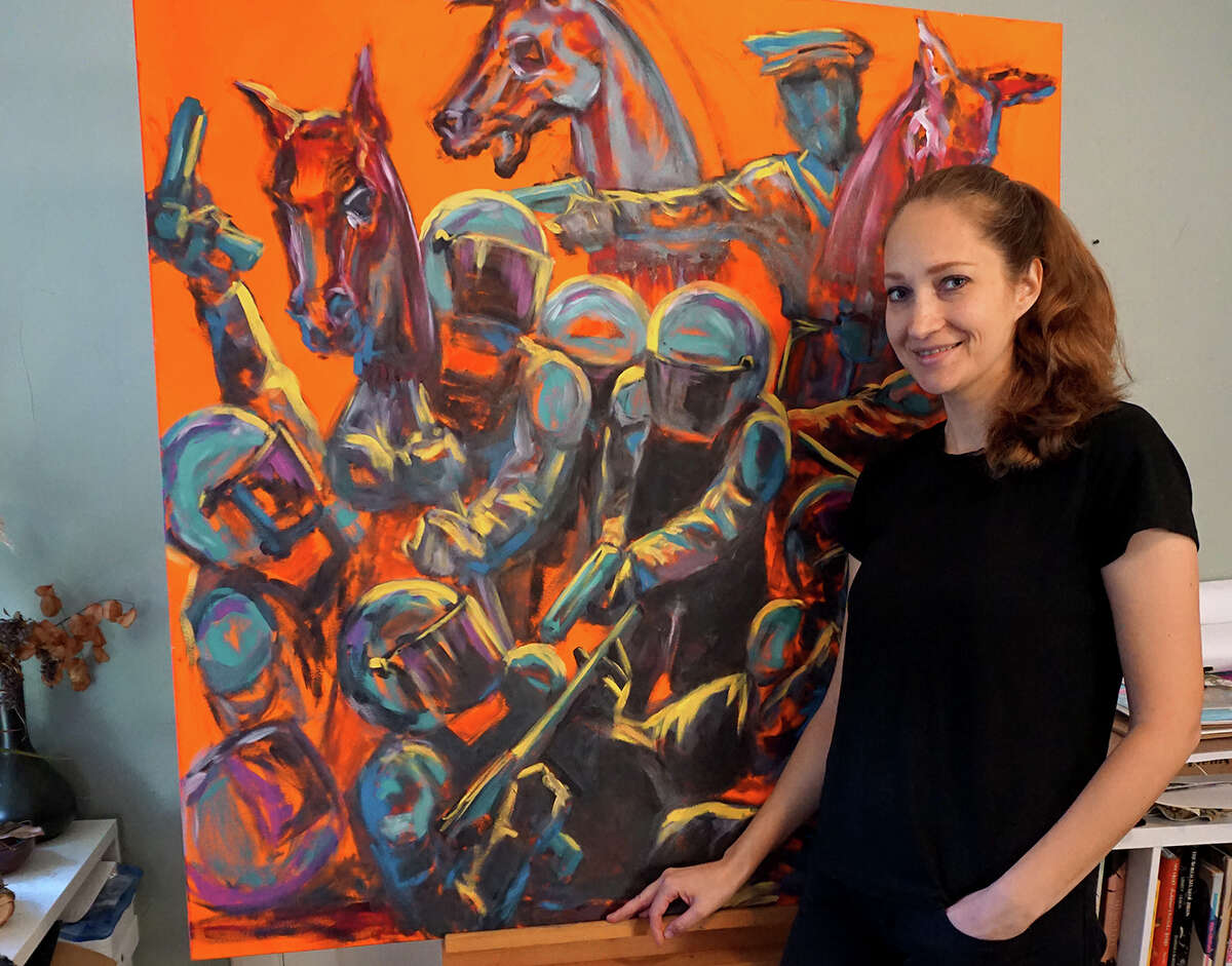 Vera Gachot with one of her paintings. Gachot will present the exhibition "Perceptions," Feb. 5-22, 2022, at The Art Studio, Inc. Courtesy photo