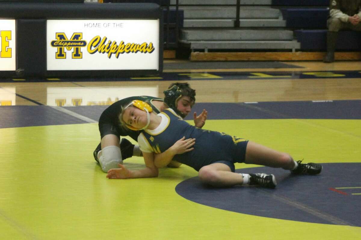 Manistee senior Raegan Codden competes in the 112-pound weight class against Muskegon Catholic Central on Jan. 19.