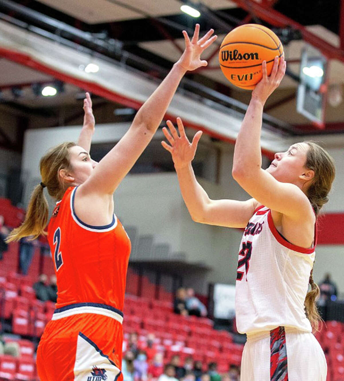 SIUE's Allie Troeckler (right) shoots over UT Martin's Ella Thompson on Thursday in an OVC women's basketball game at First Community Arena in Edwardsville.
