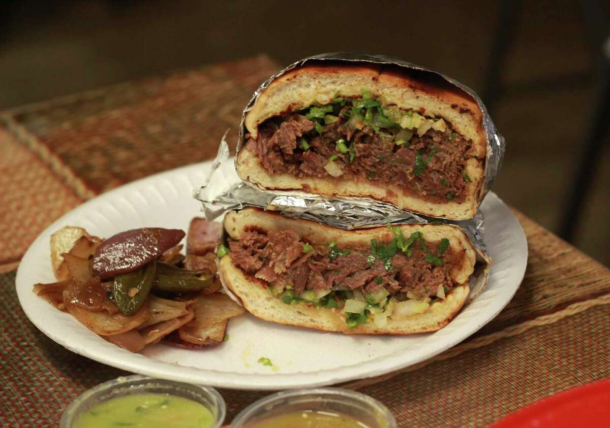 El Tacostao’s tortas are made with ultra-tender beef on fluffy telera bread with a side of grilled onions.