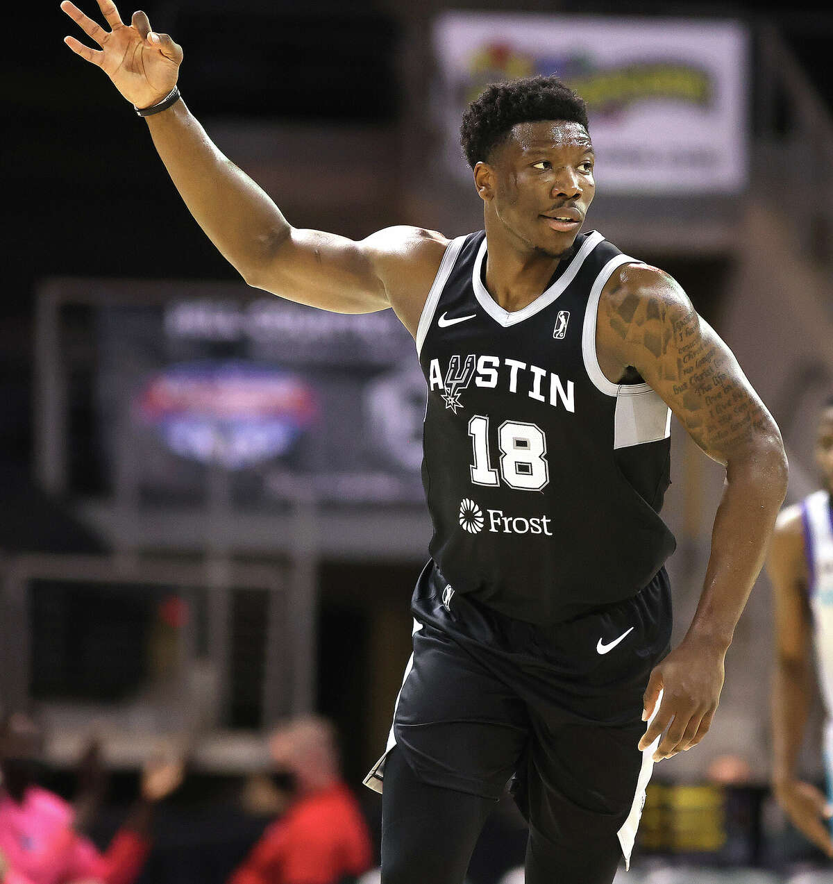 CEDAR PARK, TX - DECEMBER 2: Devontae Cacok #18 of the Austin Spurs reacts after making a 3-point shot against Greensboro Swarm during a NBA G-League game on December 2, 2021 at the H-E-B Center At Cedar Park in Cedar Park, Texas. Copyright 2021 NBAE (Photo by Chris Covatta/NBAE via Getty Images)