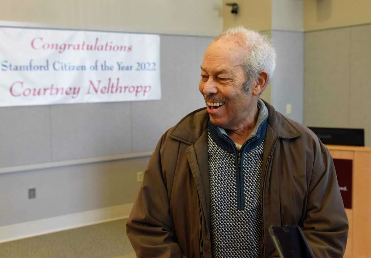 Courtney Nelthropp is surprised to receive the Stamford Citizen of the Year Award at Tully Health Center in Stamford on Thursday. Friends and family gathered with former award recipients to surprise Nelthropp with the award when he thought he was going to a physical therapy appointment. He recently retired after a successful career as the Charter Oak Communities Chairman.